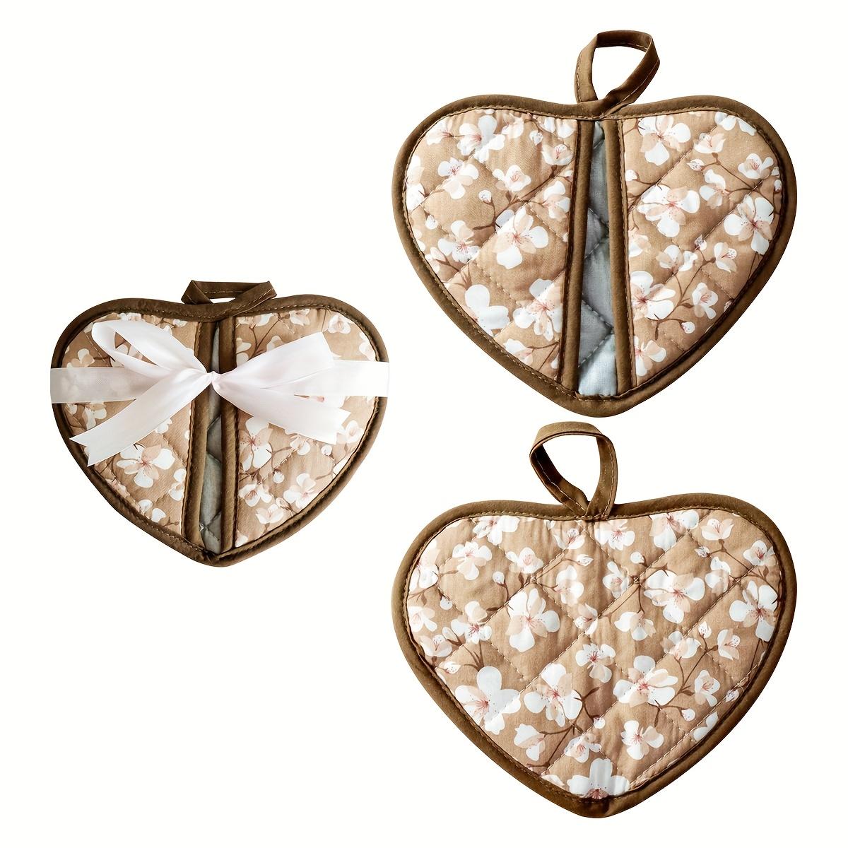A Set of Two Heart-Shaped Heat-Resistant Pads Packaged with Ribbon Thick Fabric